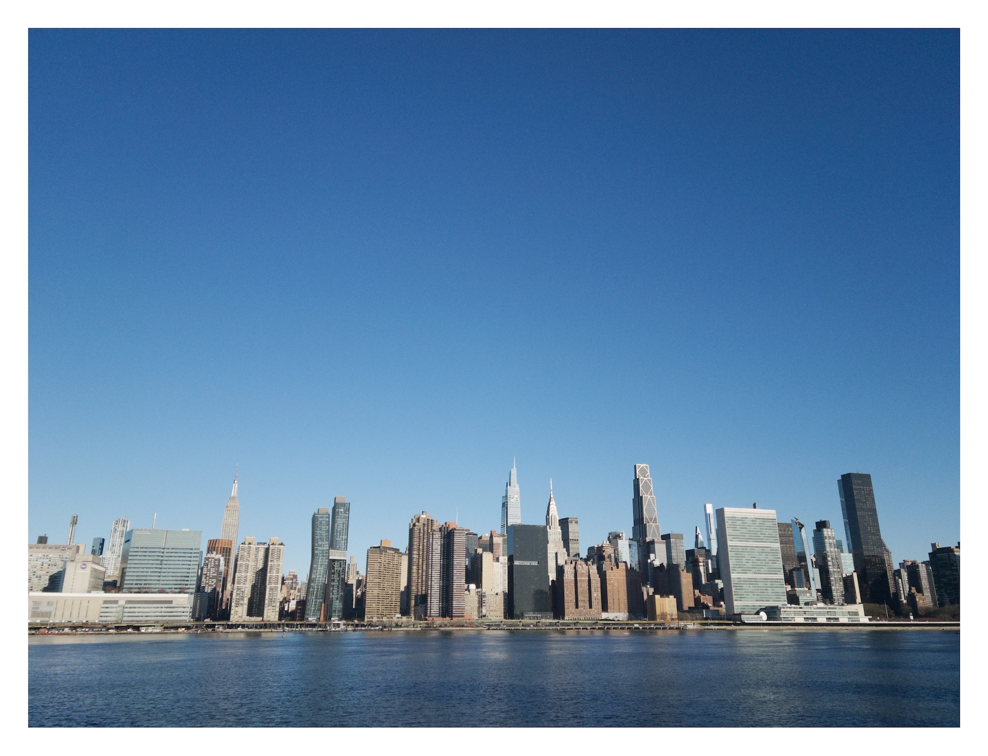 Manhattan skyline beyond the East River as seen from Hunter's Point in Queens