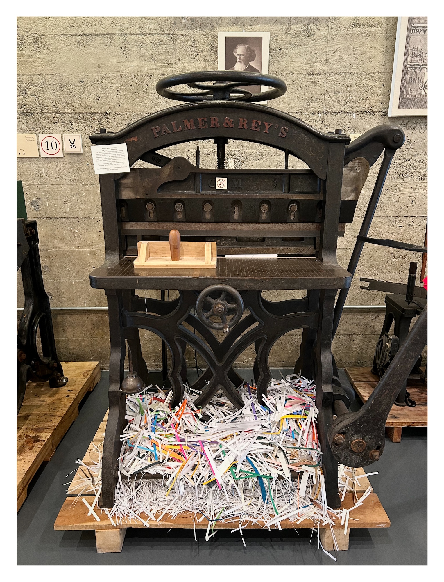 a large paper guillotine trimmer at the American Bookbinder Museum, ready to cut pages to size
