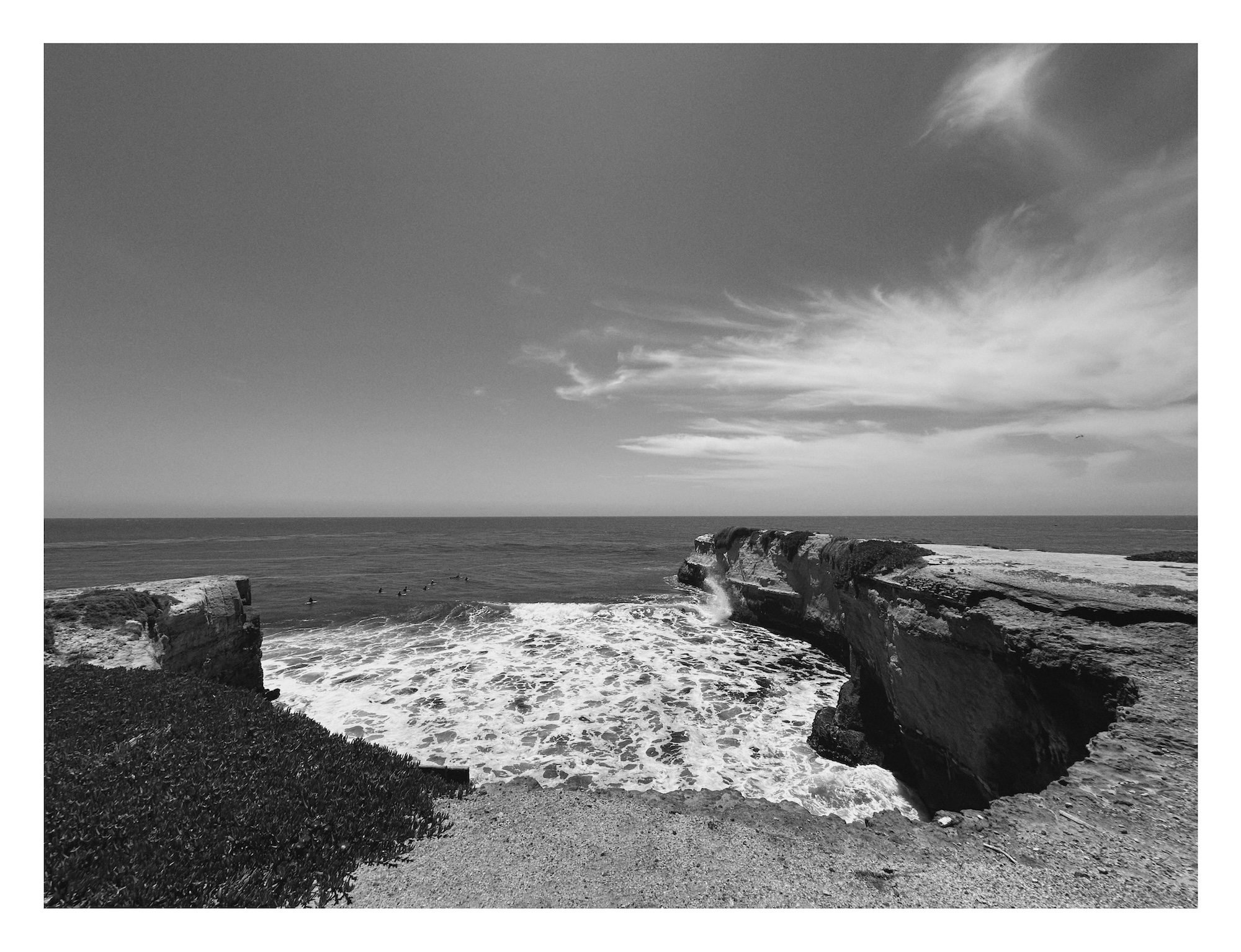 view from cliffs above a surf spot